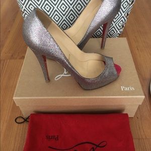 Christian Louboutin glitter leather shoes.
